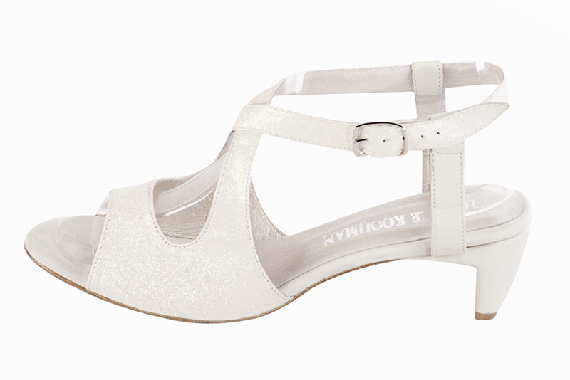 Off white women's open back sandals, with crossed straps. Round toe. Low comma heels. Profile view - Florence KOOIJMAN